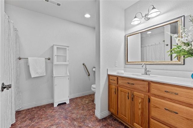 9299 W Forest Hills Dr, Fayetteville, AR 72704 - bathroom featuring toilet, vanity, and baseboards
