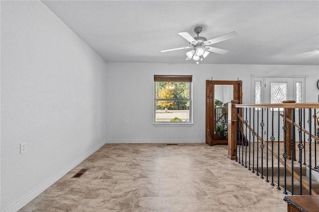 9299 W Forest Hills Dr, Fayetteville, AR 72704 - empty room with a ceiling fan and baseboards