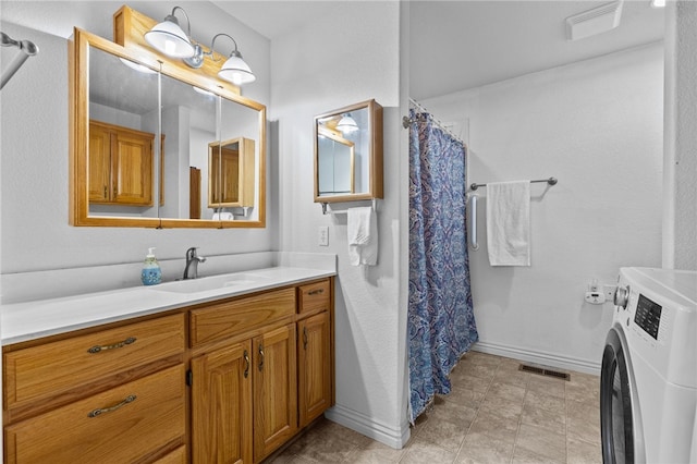 bathroom with vanity, washer / clothes dryer, and a shower with curtain