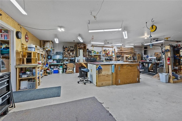 9299 W Forest Hills Dr, Fayetteville, AR 72704 - miscellaneous room with concrete floors and a workshop area