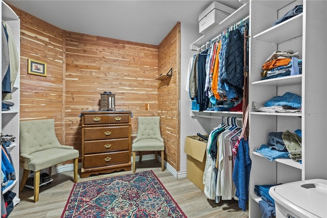 walk in closet featuring light hardwood / wood-style floors