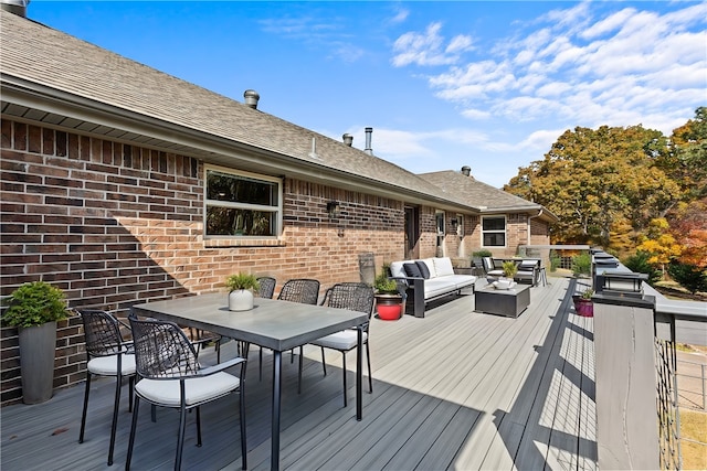 wooden terrace featuring outdoor lounge area