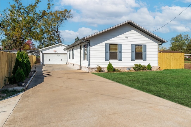 view of front of property with an outbuilding, a front lawn, and a garage