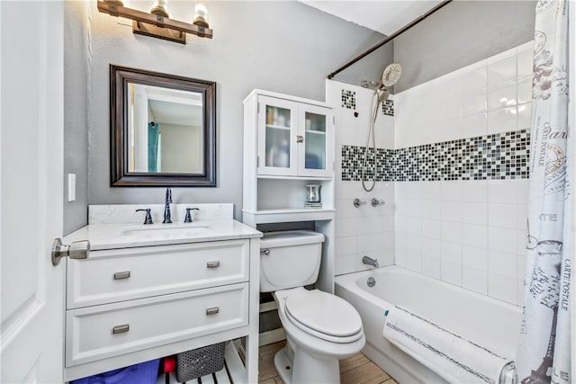 full bathroom with vanity, hardwood / wood-style flooring, toilet, and shower / bathtub combination with curtain