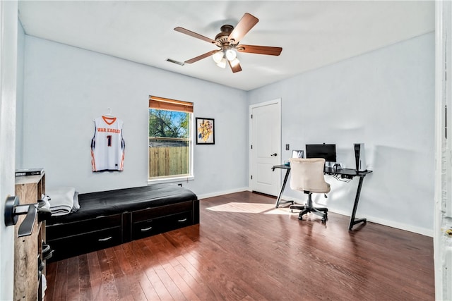 home office featuring dark hardwood / wood-style floors and ceiling fan