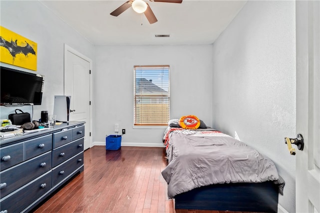 bedroom featuring dark wood-type flooring and ceiling fan