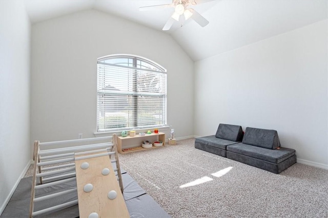 recreation room with lofted ceiling, carpet floors, and ceiling fan