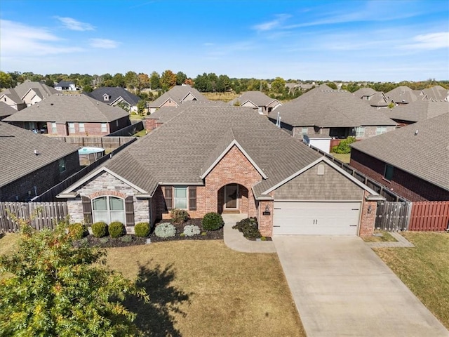 view of front of home with a garage and a front lawn