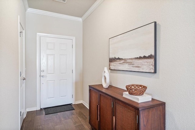 doorway with ornamental molding and dark hardwood / wood-style floors