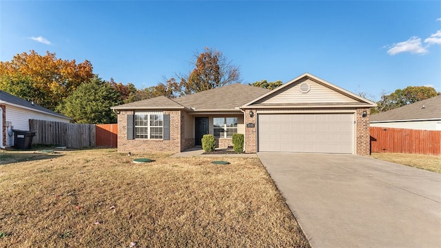 ranch-style house featuring a front lawn and a garage