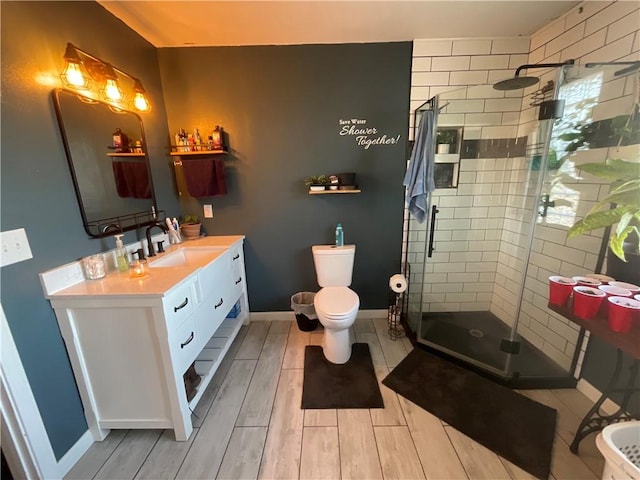 52720 S 680, Colcord, OK 74338 - full bathroom featuring vanity, a shower stall, toilet, and wood tiled floors