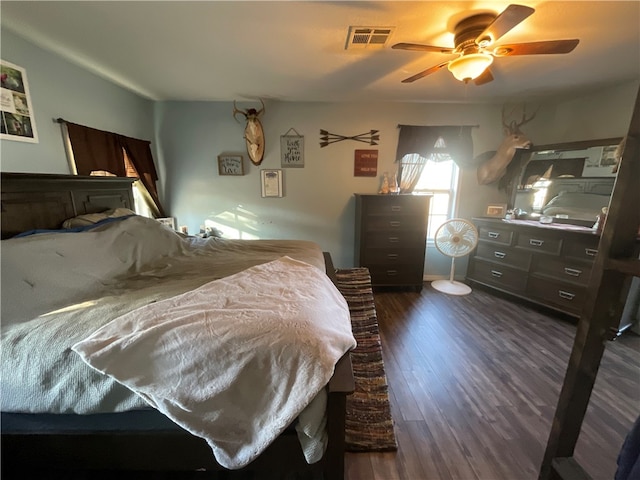 bedroom featuring dark hardwood / wood-style floors and ceiling fan