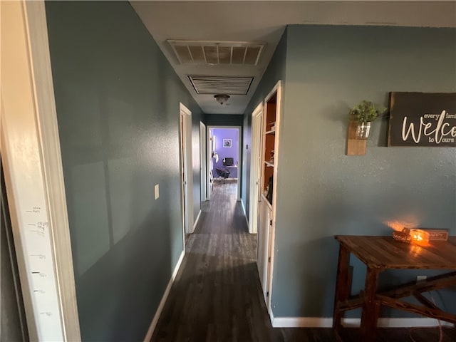 corridor featuring dark wood-type flooring