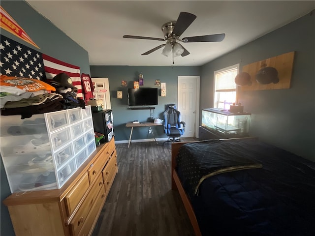 bedroom with ceiling fan and dark hardwood / wood-style flooring