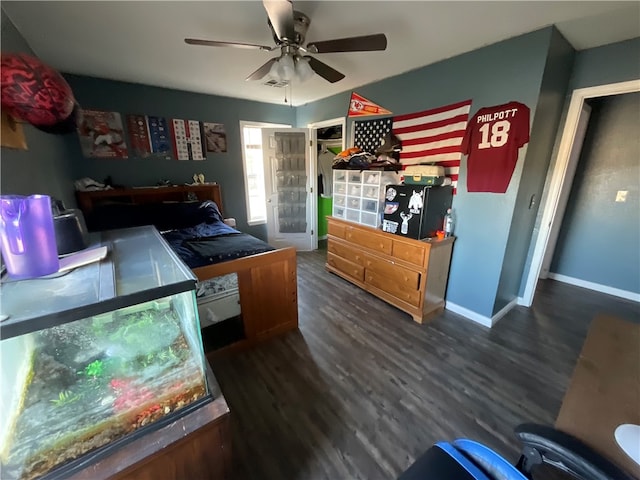 bedroom featuring dark hardwood / wood-style floors and ceiling fan