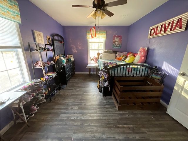 bedroom featuring dark wood-type flooring and ceiling fan