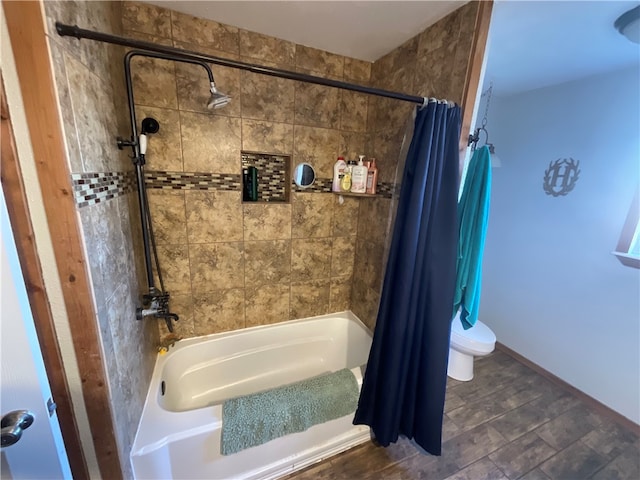 bathroom with toilet, shower / bath combo, and wood-type flooring