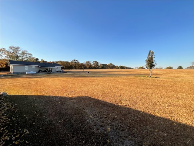 view of yard with a rural view