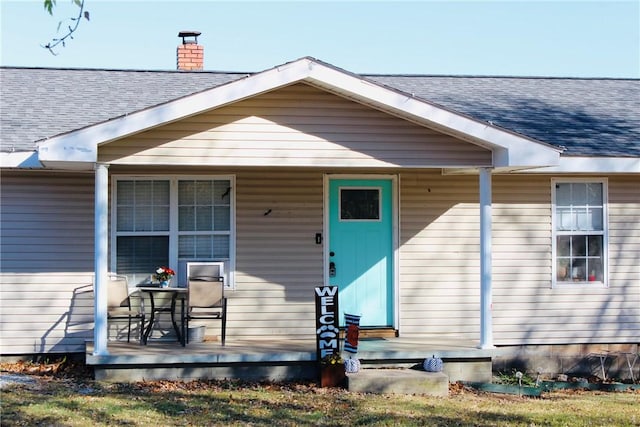 52720 S 680, Colcord, OK 74338 - entrance to property with a porch, roof with shingles, and a chimney