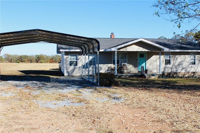 52720 S 680, Colcord, OK 74338 - ranch-style home with a porch, a detached carport, and a chimney