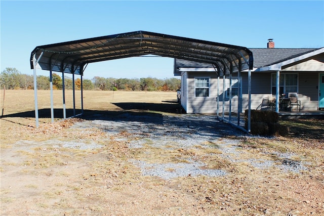 view of vehicle parking with a carport