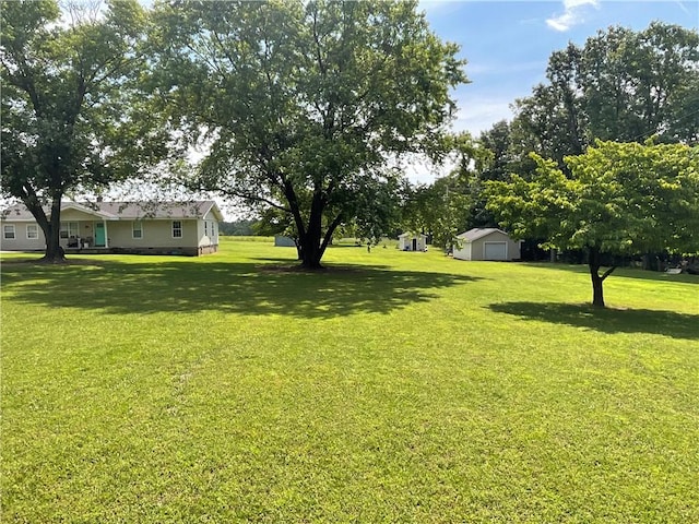 52720 S 680, Colcord, OK 74338 - view of green lawn featuring a garage