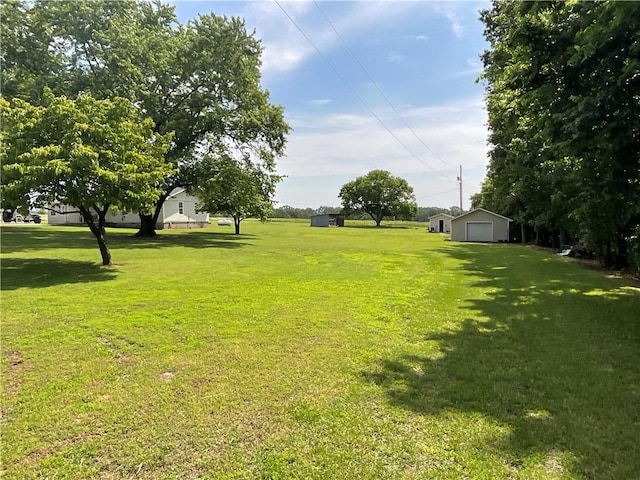 52720 S 680, Colcord, OK 74338 - view of green lawn with a detached garage and an outdoor structure