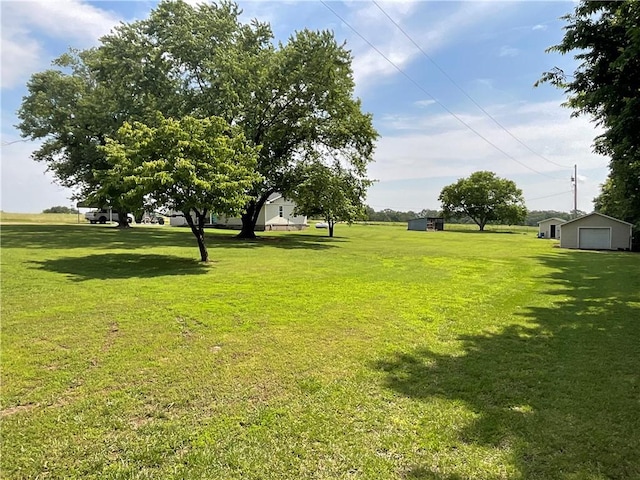 52720 S 680, Colcord, OK 74338 - view of grassy yard with a garage and an outbuilding
