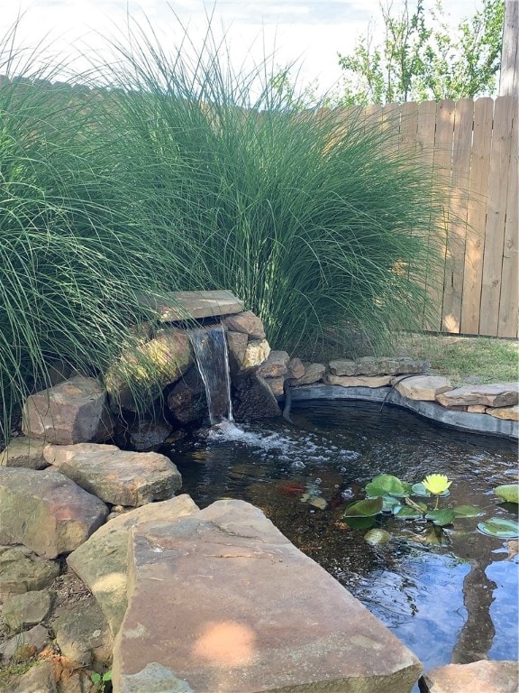 exterior details featuring a small pond