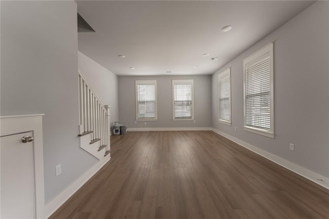 unfurnished room with dark hardwood / wood-style floors