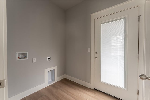 washroom with hookup for a washing machine, light hardwood / wood-style floors, and electric dryer hookup