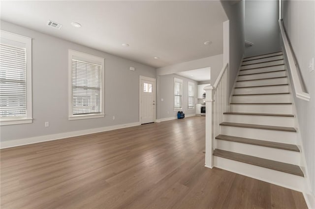 foyer entrance with wood-type flooring