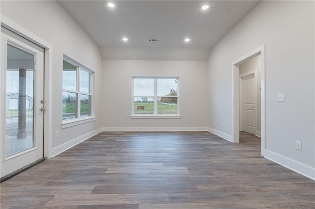 empty room with dark wood-type flooring