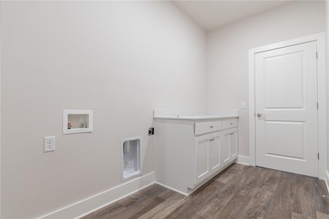 washroom with washer hookup, electric dryer hookup, and dark wood-type flooring