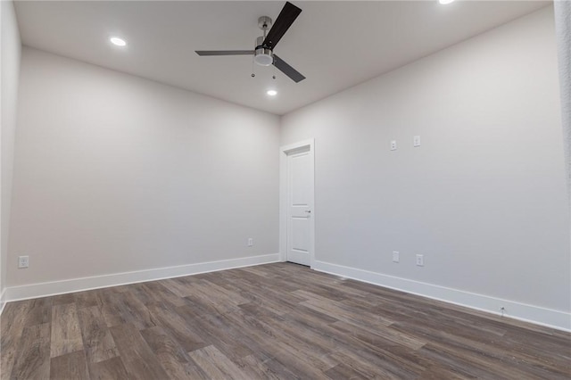 unfurnished room featuring ceiling fan and dark wood-type flooring