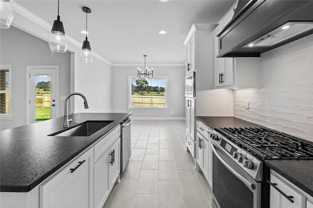 kitchen with white cabinets, sink, an island with sink, appliances with stainless steel finishes, and custom range hood