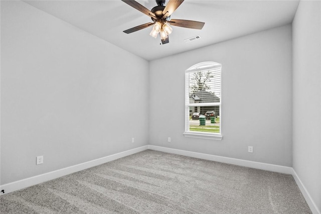 spare room featuring carpet flooring and ceiling fan