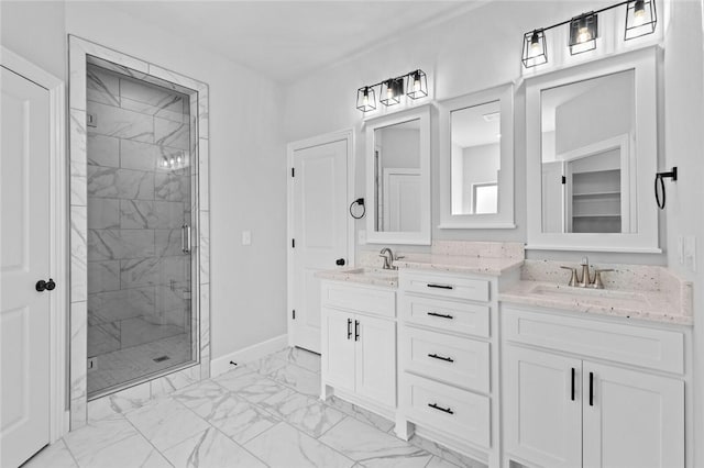 bathroom with vanity and a shower with door