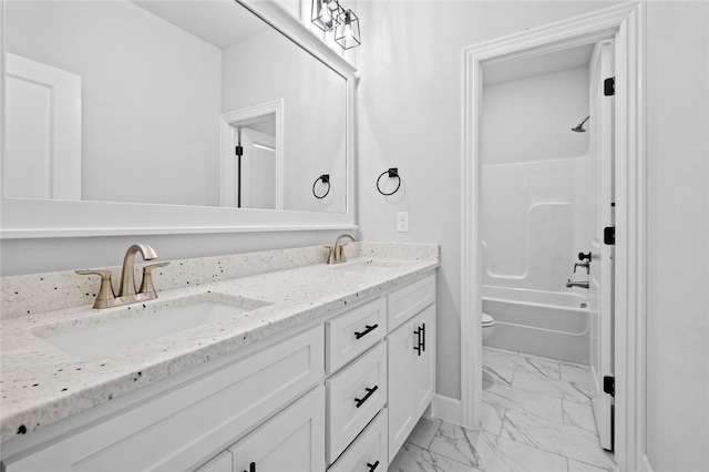 full bathroom with shower / tub combination, vanity, and toilet