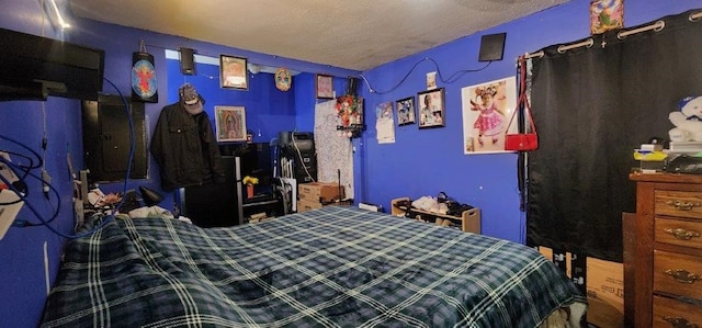 bedroom featuring a textured ceiling