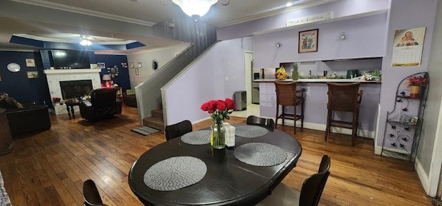 dining room featuring hardwood / wood-style flooring and ornamental molding