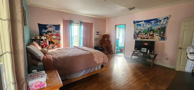 bedroom featuring ornamental molding and dark hardwood / wood-style floors