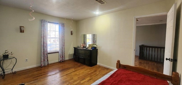 bedroom featuring hardwood / wood-style flooring