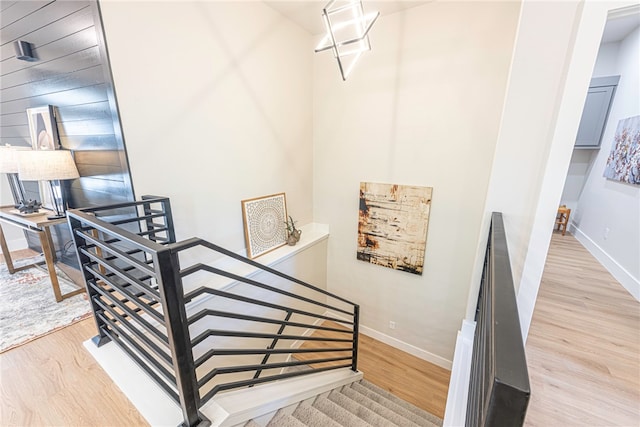 stairway featuring wood-type flooring