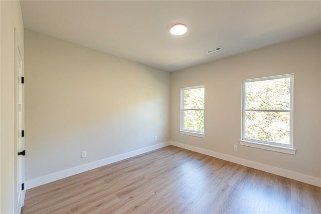 empty room with light hardwood / wood-style floors