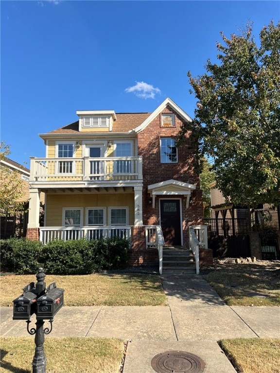 view of front of house featuring a balcony