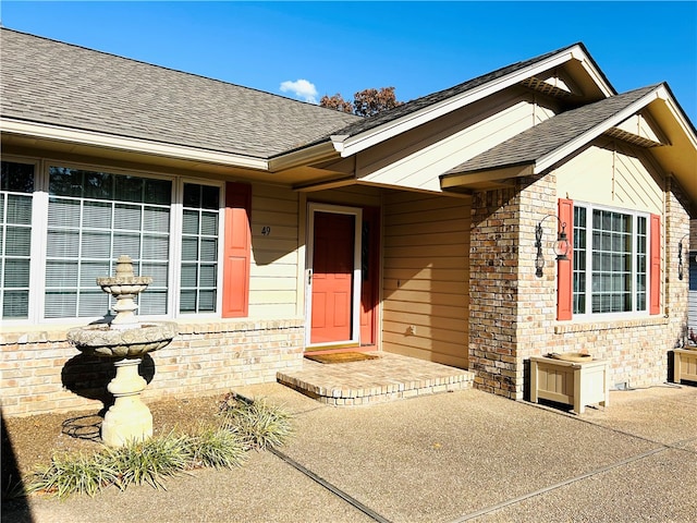 property entrance featuring a patio