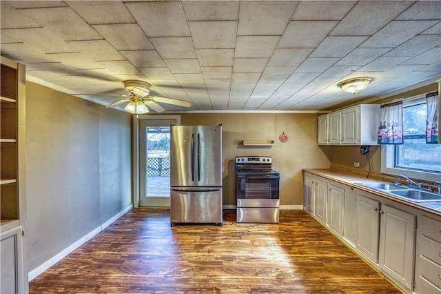 kitchen with hardwood / wood-style floors, stainless steel appliances, sink, and a wealth of natural light