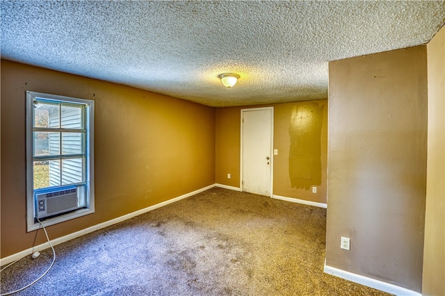 unfurnished room featuring a textured ceiling, cooling unit, and carpet floors