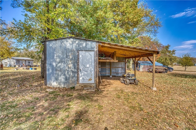 view of outdoor structure with a carport